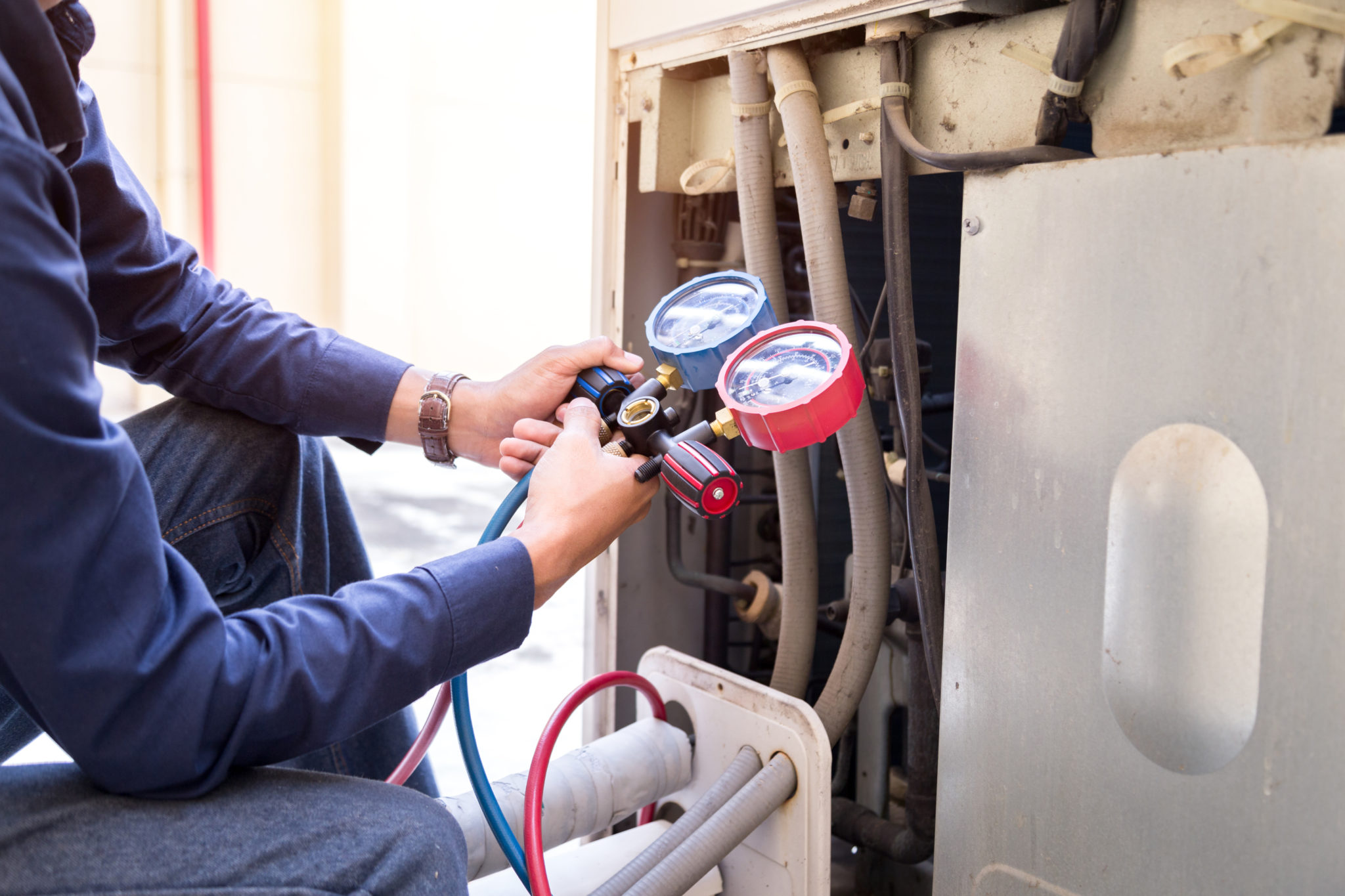 Technician working on A/C unit